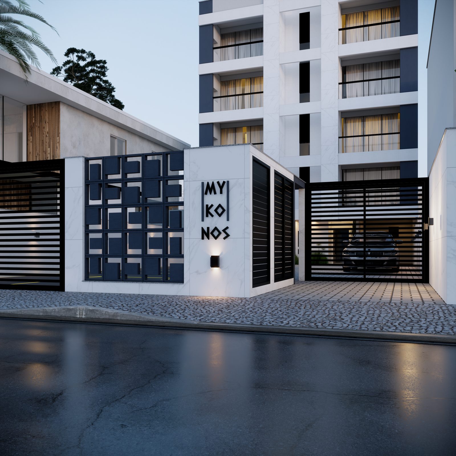 Fachada do Residencial Mykonos ao entardecer, com portaria em mármore e painel geométrico azul